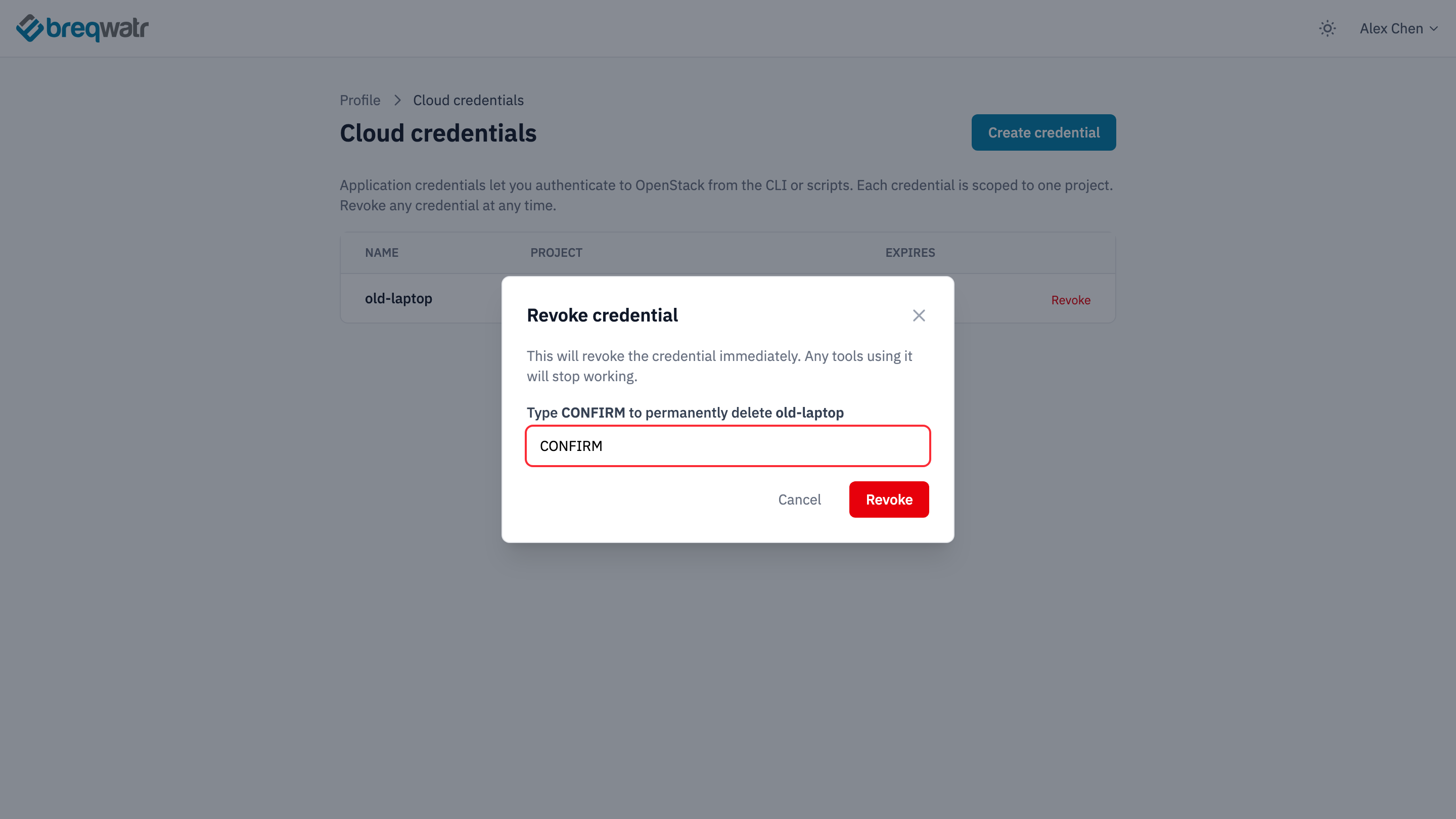 The Revoke credential dialog on the Cloud credentials page for a credential named old-laptop, with CONFIRM typed and the Revoke button